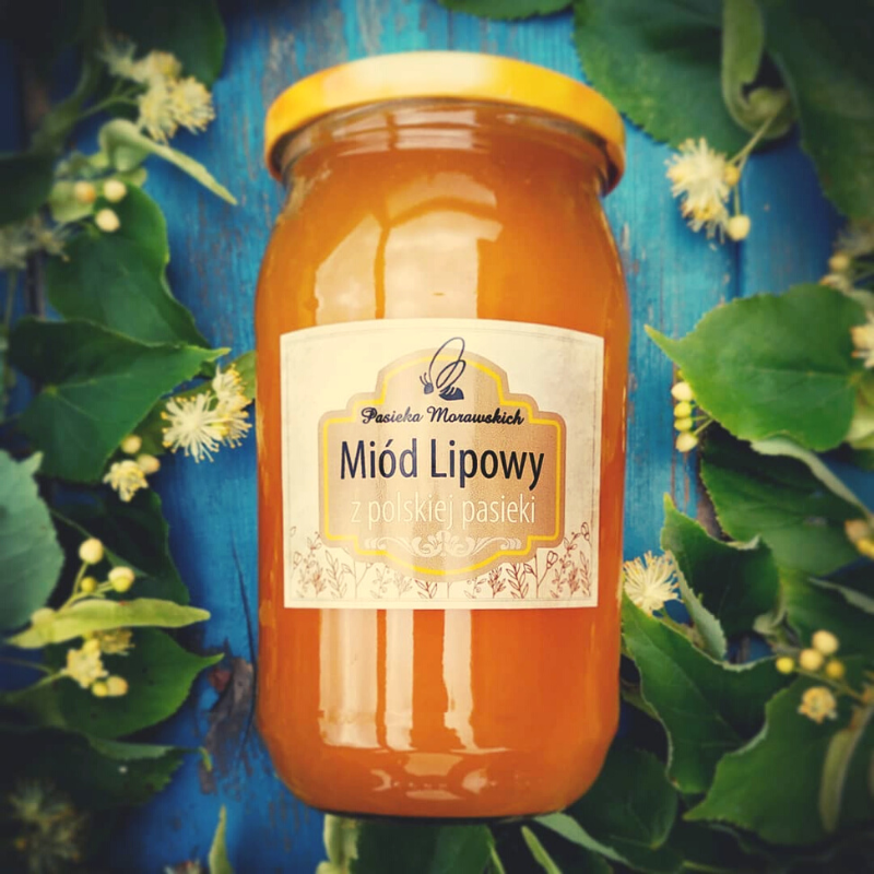 pasieka-morawscy-naturalny-miod-lipowy-na-tle-lisci-lipy