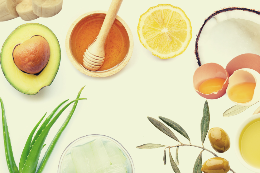 pol-awokado-miod-w-drewnianej-misce-z-lyzka-do-miodu-liscie-aloesu-kawalki-aloesu-w-misce-jajka-cytryna-banany-oliwa-z-oliwek-galazka-i-w-misce-pol-kokosa-skladniki-domowych-maseczek-na-wlosy-z-miodem